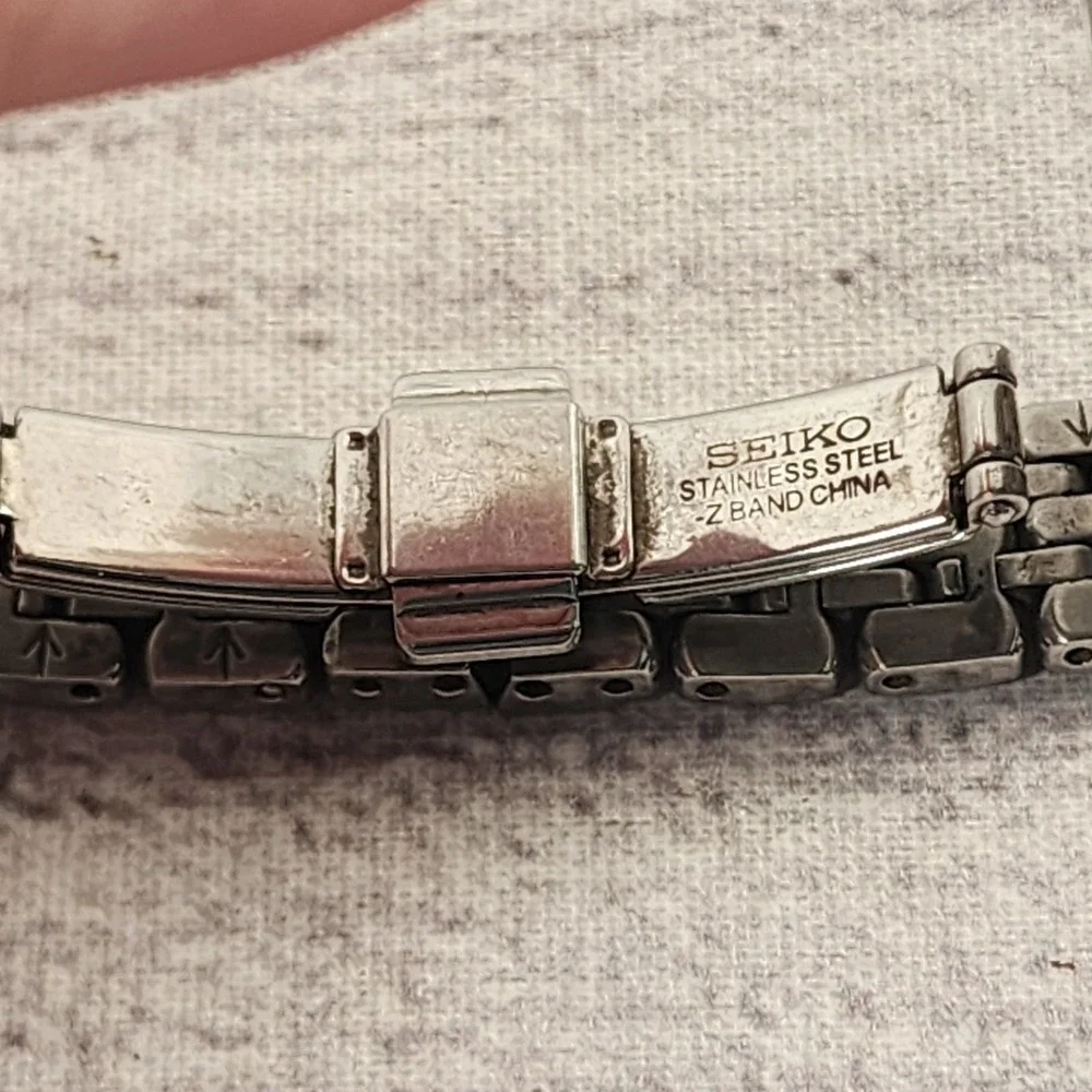 Seiko Women Watch Pink Dial Stainless Steel Rope Bezel 1N00-0JJ0 Silver Tone